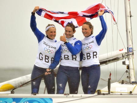 Sarah Ayton, Sarah Webb, and Pippa Wilson of Great Britain celebrate after victory of the Yngling medal race at the Beijing 2008 Olympic Games sailing event at Qingdao Olympic Sailing Center in Qingdao, an-Olympic co-host city in eastern China’s Shandong Province, Aug. 17, 2008. The British team won the gold medal of the event. [Xinhua Photo] 