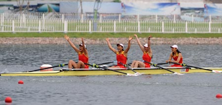 Tang Bin, Jin Ziwei, Xi Aihua and Zhang Yangyang of China celebrate after Women's Quadruple Sculls Final A of Beijing 2008 Olympic Games rowing event at Shunyi Rowing-Canoeing Park in Beijing, China, Aug. 17, 2008. The Chinese team won the gold medal of the event with a time of 6 minutes and 16.06 seconds. [Xinhua]