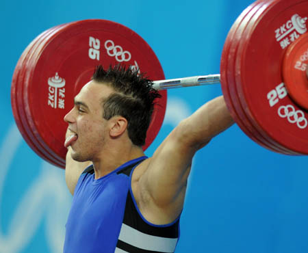 Ilya Ilin of Kazakhstan takes a lift during the men's weightlifting 94kg group A competition at Beijing 2008 Olympic Games in Beijing, China, Aug. 17, 2008. Ilya Ilin won the gold medal in the event. (Xinhua/Yang Lei)