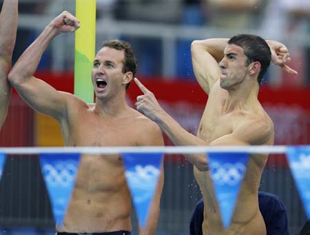 US swimmers Michael Phelps (R) and Aaron Peirsol celebrate after their team winning the men's 4x100m medley relay final at the Beijing 2008 Olympic Games in the National Aquatics Center, also known as the Water Cube in Beijing, China, Aug. 17, 2008. US swimmers set a new world record of the event in a time of 3 minutes 29.34 seconds and won the gold medal. (Xinhua/Fan Jun)