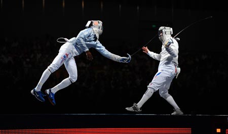 Boris Sanson of France competes with Keeth Smart of US during men's team sabre gold medal match of Beijing 2008 Olympic Games fencing event at Fencing Hall in Beijing, China, Aug. 17, 2008. France beat US 45-37 and won the gold medal.