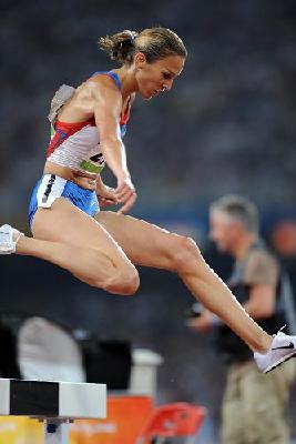 Russia's Gulnara Galkina-Samitova won the gold medal of the women's 3000 meters steeplechase and set a new world record at the Beijing Olympic Games on Sunday.