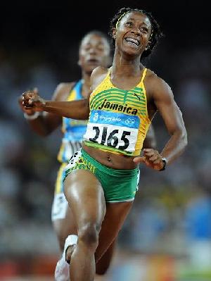 Sehlly-Ann Fraser became the world's fastest woman as she led Jamaica to a cleansweep of the medals in the 100 meters final at the Beijing Olympic Games on Sunday.