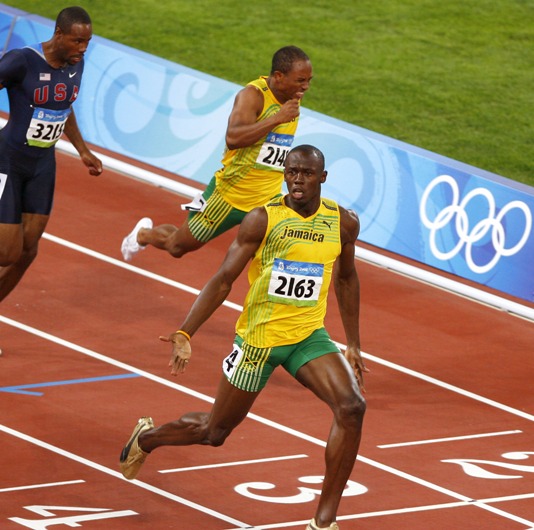 Jamaican Usain Bolt dashed to his first Olympic gold in the men's 100m, blistering a world record-breaking 9.69 seconds. The 21-year-old Bolt didn't even use all his strength in final his final strides, while slamming his chest with right palm before reaching the finish line. Bolt said, 'I came here to prove that I'm the best in the world. I just came here to win.' [Xinhua]
