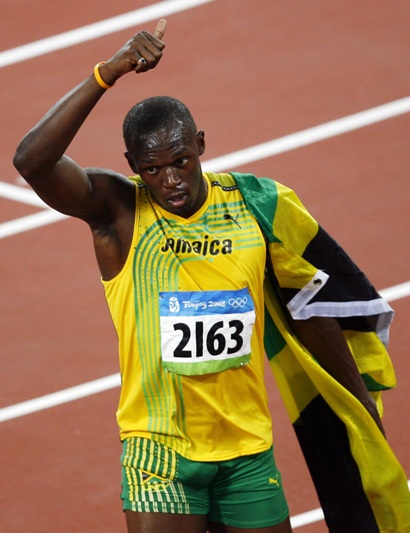 Jamaican Usain Bolt dashed to his first Olympic gold in the men's 100m, blistering a world record-breaking 9.69 seconds. The 21-year-old Bolt didn't even use all his strength in final his final strides, while slamming his chest with right palm before reaching the finish line. Bolt said, 'I came here to prove that I'm the best in the world. I just came here to win.' [Xinhua]