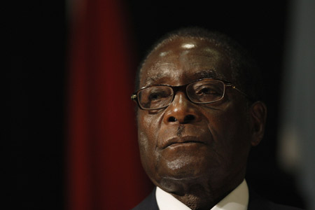 Zimbabwe's President Robert Mugabe listens at the opening of the summit of the Southern African Development Community (SADC) in Johannesburg, August 16, 2008. (Xinhua/Reuters Photo)
