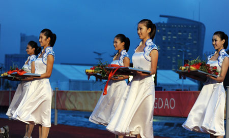Victory ceremony hostesses are ready for another ceremony in Qingdao, Shandong Province August 17, 2008. [Xinhua]