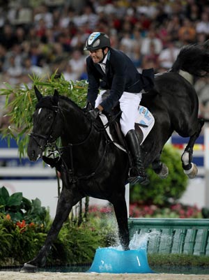 Guatemalan rider Juan Andres Rodriguez riding on horse Orestus jumps an obstacle during the jumping individual 2nd qualifier competition of the Beijing 2008 Olympic Games equestrian events in the Olympic co-host city of Hong Kong, China, Aug 17,2008.