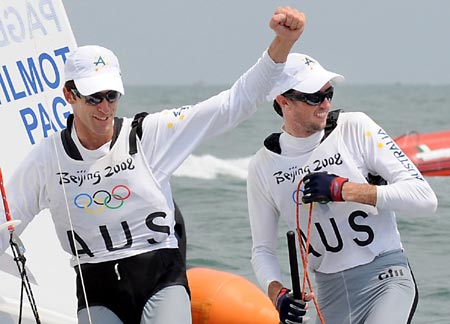 Nathan Wilmot and Malcolm Page of Australia celebrate after the 470 Men Medal Race at the Beijing 2008 Olympic Games sailing event at Qingdao Olympic Sailing Center in Qingdao, an-Olympic co-host city in eastern China's Shandong Province, Aug. 18, 2008. The Australian pair won the gold medal.[Xinhua]  