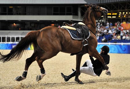 Azerbaijani rider Jamal Rahimov falls from his horse Ionesco de Brekka during the jumping individual 2nd qualifier competition of the Beijing 2008 Olympic Games equestrian events in the Olympic co-host city of Hong Kong, south China, Aug 17, 2008. Rahimov was eliminated from the competition due to his falling. 