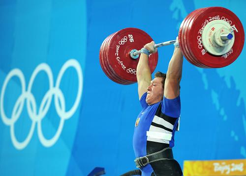 Andrei Aramnau of Belarus broke three world records to win the men's 105kg weightlifting gold medalon Monday. 
