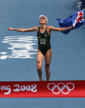 Emma Snowsill of Australia crosses the finish line in the Women's Final of Beijing 2008 Olympic Games triathlon event in Beijing, China, Aug. 18, 2008. Emma Snowsill won the gold medal with a time of 1 hour 58 minutes and 27.66 seconds.