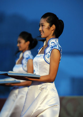 Victory ceremony hostesses are ready for another ceremony in Qingdao, Shandong Province August 17, 2008.