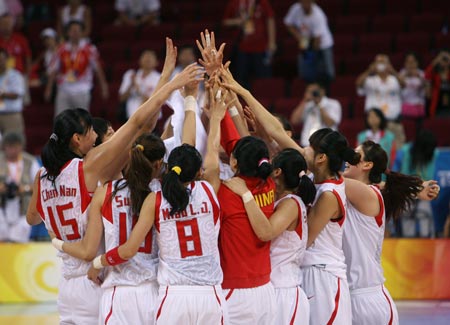 Players of China celebrate after the match China VS Belarus in women's quartefinal of the Beijing 2008 Olympic Games Basketball event in Beijing, China, Aug. 19, 2008. China beat Belarus 77-62 and qualified the next round. 