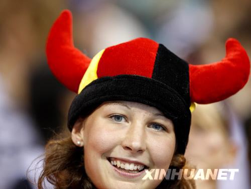 A German girl shows support for her team by wearing a horned hat in Germany's national colors. Germany beats Egypt 25-23 in their Men's handball preliminary contest on August 14. [Cai Yang/Xinhua]