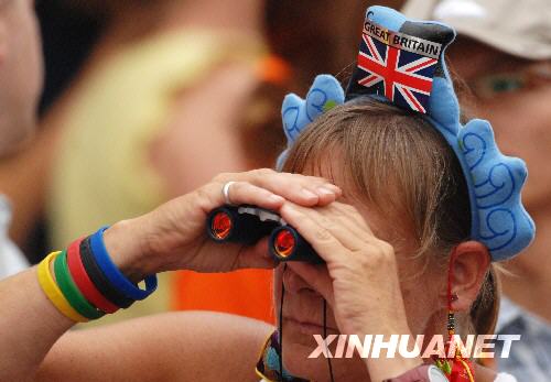 A British fan wearing a Beibei hair grip. Beibei is a little water creature, one of the five official Fuwa mascots of the 2008 Beijing Olympic Games. [Jiang Enyu/Xinhua, August 17]