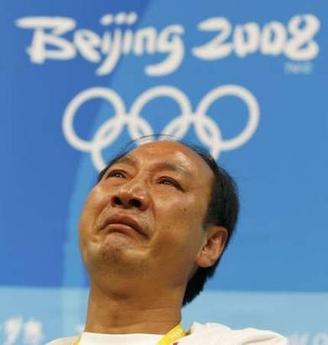 Sun Haiping, coach of China's Liu Xiang, cries during a new conference following Liu's failure to start his men's 110m hurdles heat in the National Stadium. Alvin Chan (CHINA)/REUTERS