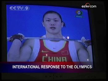 People sit watching the Olympic competitions inside the China Hotel in Delft, the Netherlands.