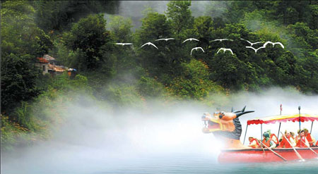 Dragon boat in mist on the Xin'an River Dragon boat in mist on the Xin'an River