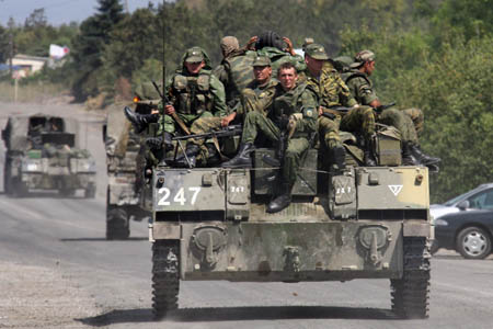 Russian troops and armored vehicles pull out from the city of Gori, Georgia, Aug. 18, 2008. It was reported earlier that Russian forces had started to withdraw from Tskhinvali, capital of Georgia's breakaway region of South Ossetia, toward the Russian region of North Ossetia. 