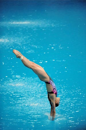 Chinese diver Wu Minxia competes during the women's 3m springboard final at the Beijing 2008 Olympic Games in the National Aquatics Center, also known as the Water Cube in Beijing, China, Aug. 17, 2008. Wu won the bronze medal in the event with a score of 389.85 points. (Xinhua/Zhao Peng)(
