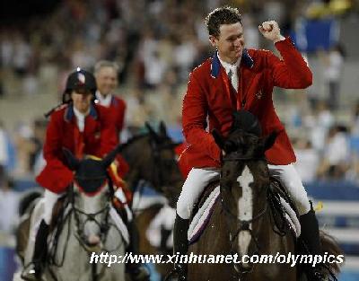 Rider Mclain Ward of the U.S. celebrates after winning of the team jumping final of the Beijing 2008 Olympic Games equestrian events in Hong Kong, south China, Aug. 18, 2008. The team of the United States won the gold medal of team jumping of the Beijing 2008 Olympic Games equestrian events with total penalities of 20 and 0 in jump-off. (Xinhua/Zhou Lei) 