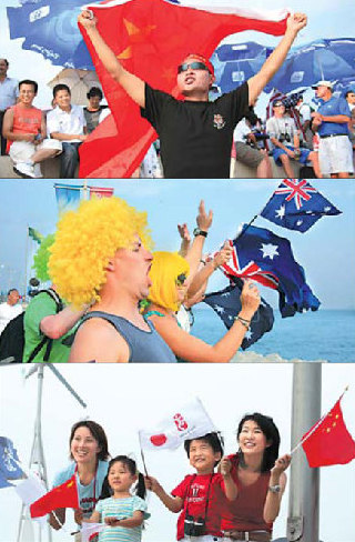  Fans from different countries and regions cheer for their athletes during the sailing competition. [Ju Chuanjiang, Ju Chenghao/China Daily]
