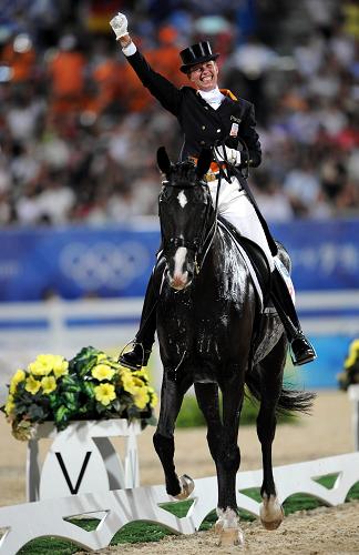 Netherlands' Anky van Grunsven won the Olympic Dressage Individual gold metal, her third consecutive title, at the Shatin Equestrian Venue Tuesday night.