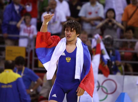 Mavlet Batirov of Russia celebrates victory during the men's freestyle 60kg gold medal match at the Beijing 2008 Olympic Games wrestling event in Beijing, China, Aug. 19, 2008. Mavlet Batirov won the bout over Vasvl Fedoryshyn of Ukraine and got the gold medal. [Xinhua]