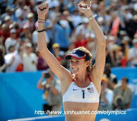 Kerri Walsh of the U.S. celebrates a point during the women's semifinal of the Beijing 2008 Olympic Games beach volleyball event with Misty May-Treanor against Renata Ribeiro and Talita Rocha of Brazil in Beijing, China, Aug. 19, 2008. 