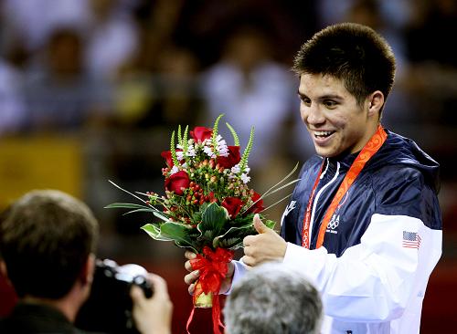 Henry Cejudo, a son of undocumented Mexican immigrants, became the first American to win a men's freestyle wrestling gold in 16 years as he won the 55kg category at the Beijing Olympic Games on on August 19, 2008. [Xinhua]