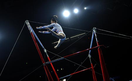 British Beth Tweddle, ranking 4th in women's uneven bars final match of Beijing Olympics, performs on the uneven bars during a gymnastics artistic gala of the Beijing 2008 Olympic Games at the National Indoor Stadium in Beijing, China, Aug. 20, 2008. 