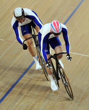 Chris Hoy (rear) of Great Britain competes in the Men&apos;s Sprint Finals of the cycling-track event during the Beijing 2008 Olympic Games at the Laoshan Velodrome in Beijing, China, Aug. 19, 2008. Chris Hoy won the gold medal.