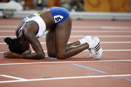 Christine Ohuruogu of Great Britain celebrates after the women's 400m final at the National Stadium, also known as the Bird's Nest, during Beijing 2008 Olympic Games in Beijing, China, Aug. 19, 2008. Christine Ohuruogu aclaimed the title with 49.62 seconds. (Xinhua/Liao Yujie)