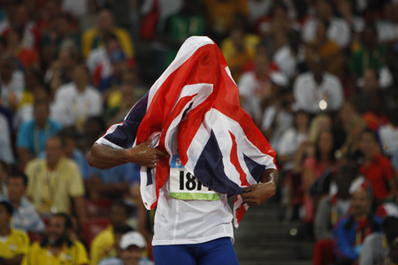 Germaine Mason of Great Britain celebrates after the men's high jump final at the National Stadium, also known as the Bird's Nest, during Beijing 2008 Olympic Games in Beijing, China, Aug. 19, 2008. Germaine Mason won the silver with 2.34 metres. (Xinhua/Liao Yujie)