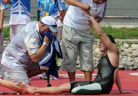 Natalie Du Toit of South Africa has her tag removed after women's marathon 10km competition at the Beijing 2008 Olympic Games swimming event in Beijing, China, Aug. 20, 2008. Natalie Du Toit ranked the 16th of the event. Du Toit, whose left leg was amputated in 2001 after she was injured in a road accident, is an athlete for both Beijing 2008 Olympic Games and Paralympic Olympics. (Xinhua/Chen Kai) 