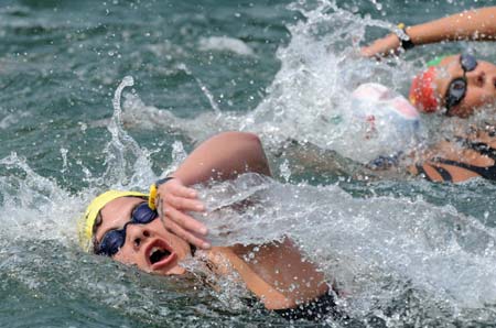 Natalie Du Toit of South Africa competes during women's marathon 10km competition at the Beijing 2008 Olympic Games swimming event in Beijing, China, Aug. 20, 2008. Natalie Du Toit ranked the 16th of the event. Du Toit, whose left leg was amputated in 2001 after she was injured in a road accident, is an athlete for both Beijing 2008 Olympic Games and Paralympic Olympics. (Xinhua/Chen Kai)