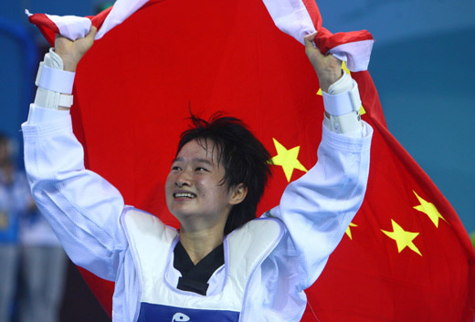 Wu Jingyu from China claimed the women's 49kg taekwondo title at the Beijing Olympics on August 20 of 2008, beating Buttree Puedpong from Thailand in the final. The bronze medals went to Dalia Contreras Rivero from Venezuela and Daynellis Montejo from Cuba. [Xinhua]