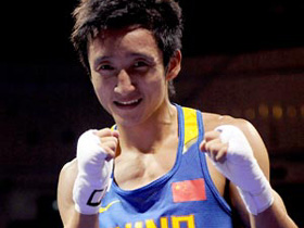 Zou Shiming of China poses at his Olympic boxing match 