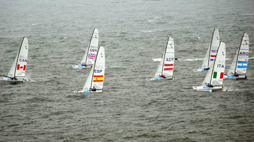Sailors compete during Tornado medal race. [Song Zhenping/Xinhua]