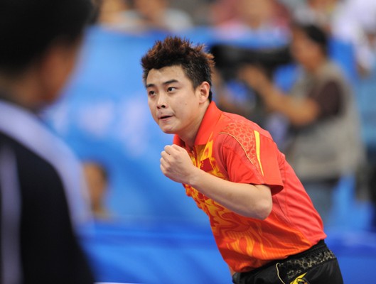 Wang Hao terminates Chinese Austrian Chen Weixing with a 4-0 without any suspence. And his teammates Ma Lin and Wang Liqin will face their opponent in men's single's third round scheduled later today at PKU Gymnasium [Xinhua]
