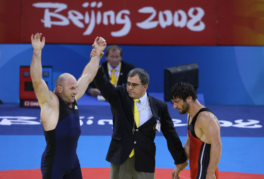 Revazi Mindorashvili from Georgia claimed the men's freestyle 84kg wrestling title at the Beijing Olympics on August 21 of 2008, beating Yusup Abdusalomov from Tajikistan 2-1 in the final. [Xinhua]