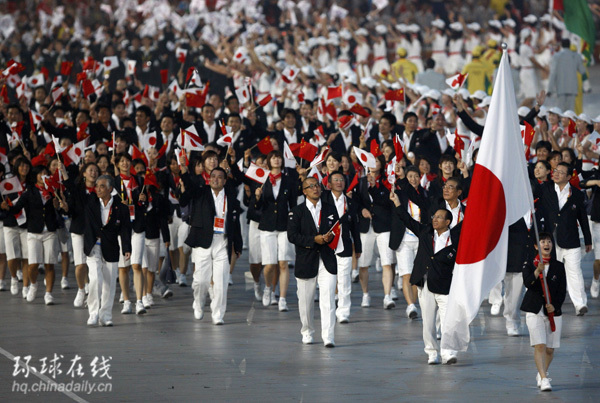 Japanese athletes walked into the Bird's Nest with Chinese and Japanese national flags in their hands at the Beijing Olympic Opening Ceremony on August 8, 2008.