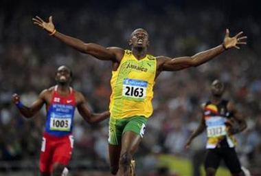 Usain Bolt of Jamaica celebrates winning the men's 200m final of the athletics competition in the National Stadium at the Beijing 2008 Olympic Games August 20, 2008.[Dylan Martinez/Reuters]