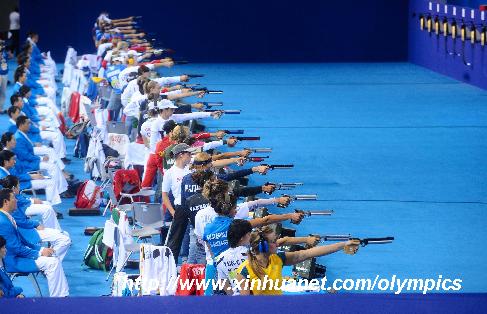 Contestants compete during 10m air pistol shooting competition of the women's modern pentathlon at the Beijing Olympic Games in Beijing, China, Aug. 22, 2008. [Luo Xiaoguang/Xinhua]