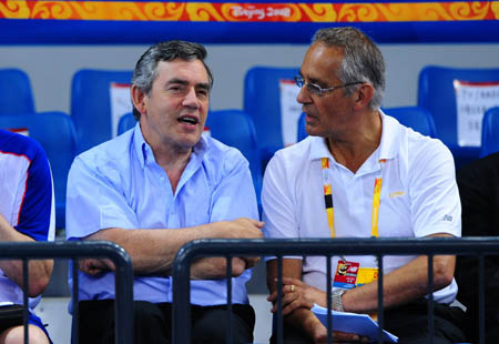 British Prime Minister Gordon Brown (L) watches fencing epee one touch competition of the women's modern pentathlon at the Beijing Olympic Games in Beijing, China, Aug. 22, 2008. [Luo Xiaoguang/Xinhua]