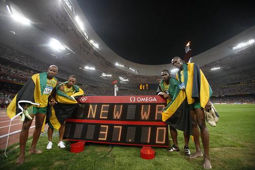 Two sprint gold medals winner Usain Bolt led Jamaica to the men's 4x100 meters win with a new world record at the Beijing Olympic Games on Friday.