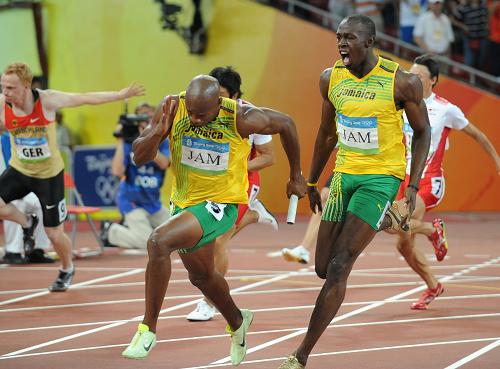 Two sprint gold medals winner Usain Bolt led Jamaica to the men's 4x100 meters win with a new world record at the Beijing Olympic Games on Friday. 