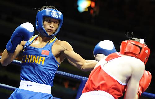 China's medal hopeful and world champion of light flyweight (48kg) boxer Zou Shiming advances into the final. 