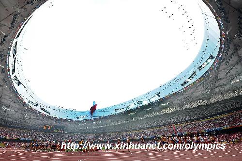 Athletes competes during men's 50km walk at the National Stadium, also known as the Bird's Nest, during Beijing 2008 Olympic Games in Beijing, China, Aug. 22, 2008. [Guo Dayue/Xinhua]